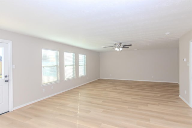 empty room featuring ceiling fan and light wood-type flooring