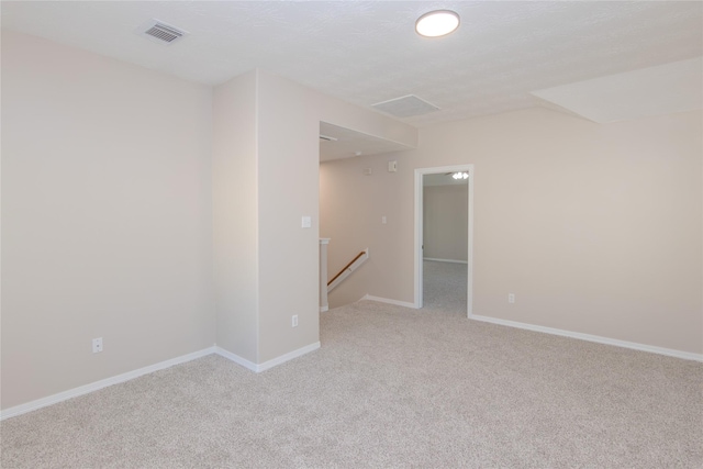 spare room with light colored carpet