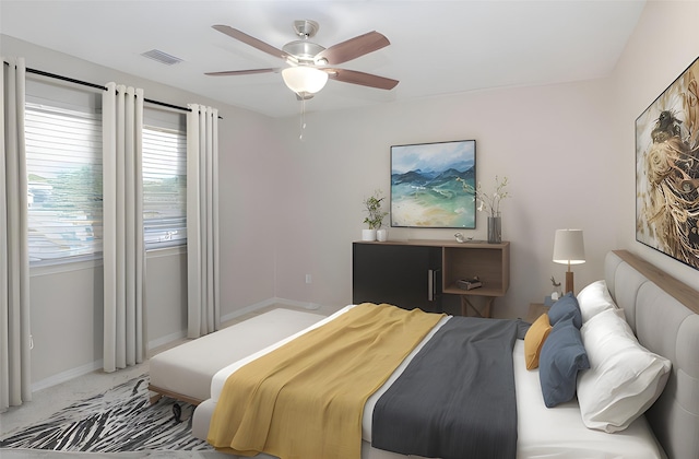 bedroom with ceiling fan and carpet