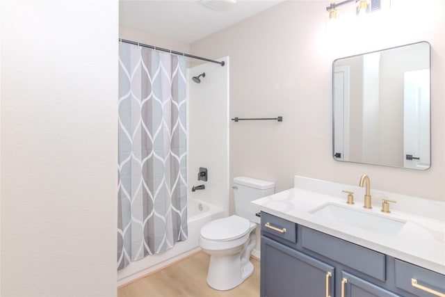 full bathroom featuring vanity, hardwood / wood-style floors, shower / bathtub combination with curtain, and toilet