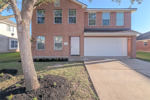 view of front facade featuring a garage and a front lawn