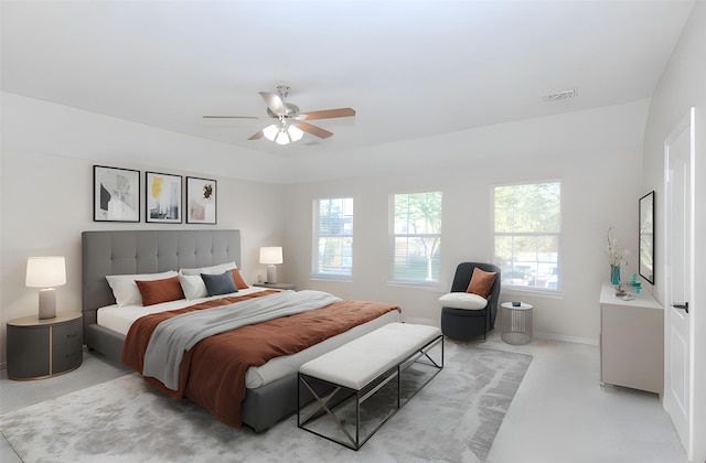 bedroom featuring ceiling fan and multiple windows