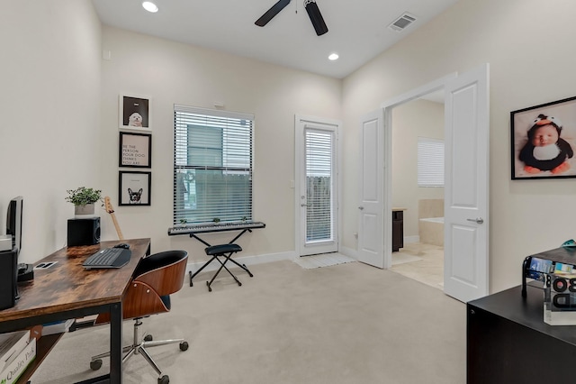 carpeted home office with ceiling fan