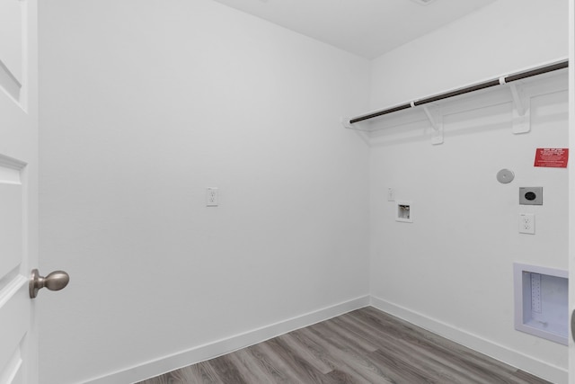 laundry area featuring hookup for a washing machine, gas dryer hookup, electric dryer hookup, and hardwood / wood-style flooring