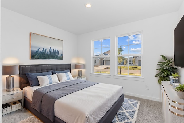 bedroom with light carpet