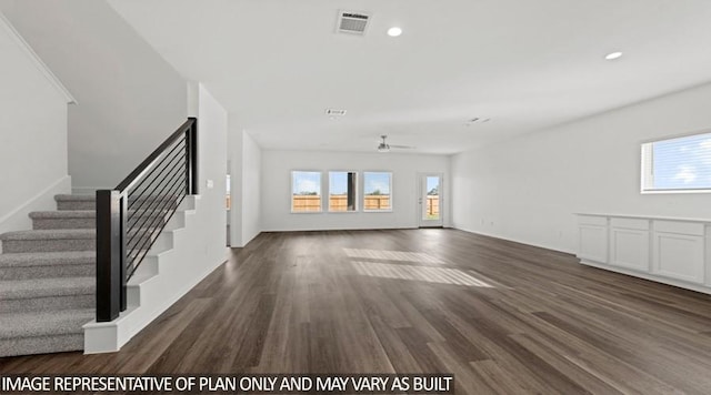 unfurnished living room with dark wood-type flooring and ceiling fan