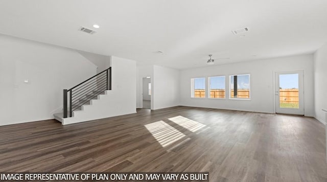 unfurnished living room featuring dark wood-type flooring