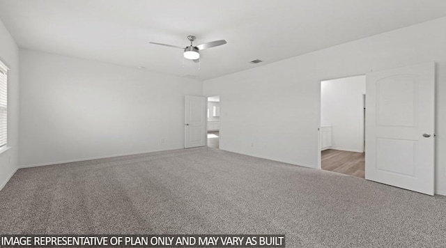 spare room with light colored carpet and ceiling fan