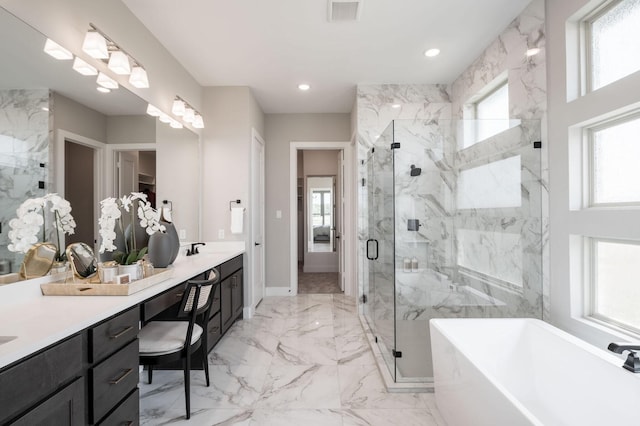 bathroom with a marble finish shower, visible vents, marble finish floor, and a freestanding bath