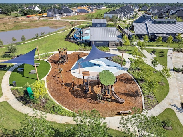 birds eye view of property with a residential view and a water view