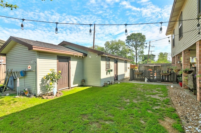 rear view of property with a yard