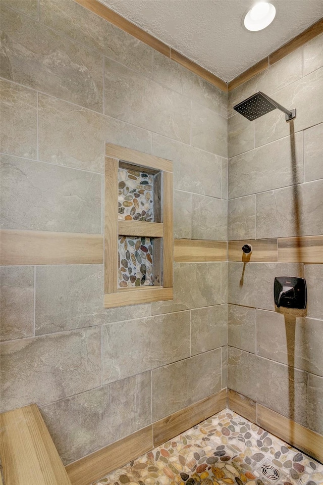 bathroom with tiled shower