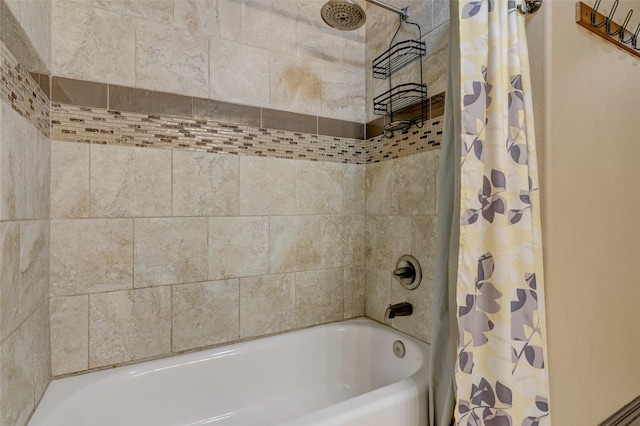 bathroom with shower / tub combo with curtain