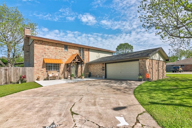 view of property with a garage and a front yard