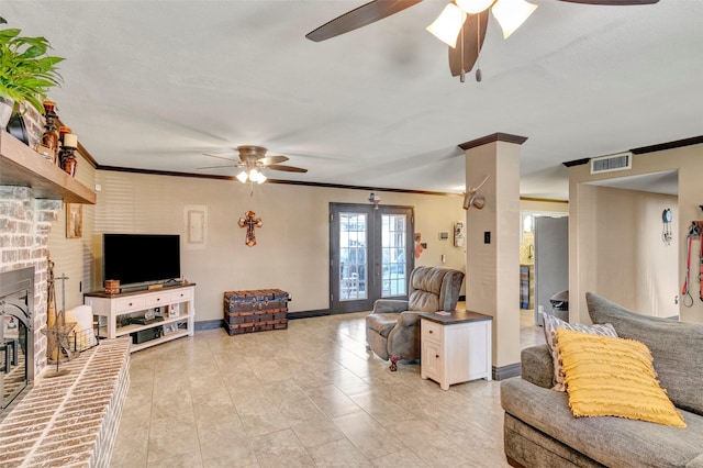 living room with crown molding, ceiling fan, and a fireplace