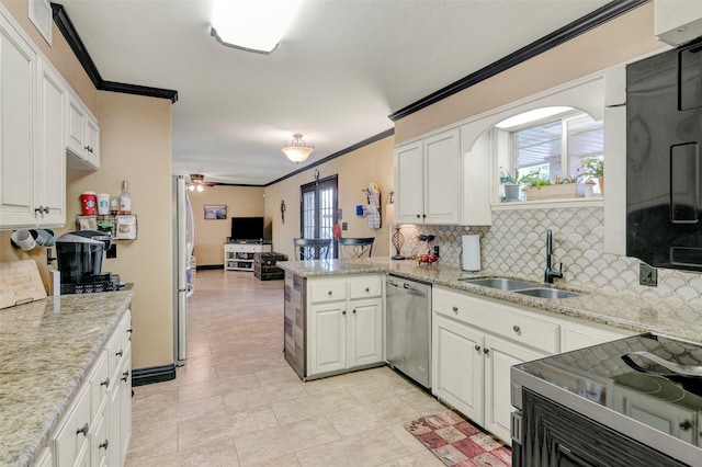 kitchen featuring sink, dishwasher, white cabinetry, decorative backsplash, and kitchen peninsula