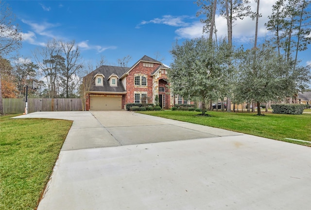 view of front facade featuring a garage and a front yard