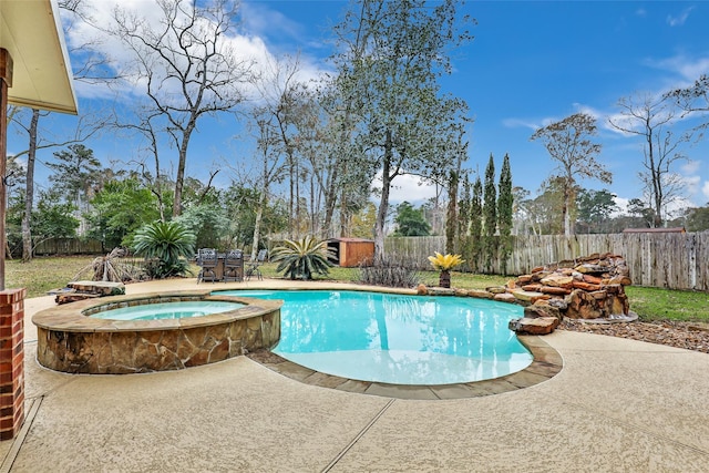 view of pool featuring an in ground hot tub and a patio