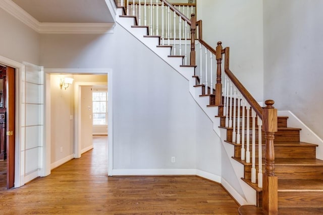 36111 Post Oak Cir, Magnolia, TX 77355 - stairs with wood finished floors and crown molding