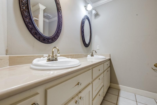 bathroom featuring crown molding, tile patterned floors, and vanity