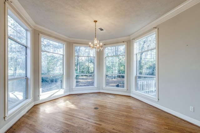 unfurnished sunroom with a notable chandelier