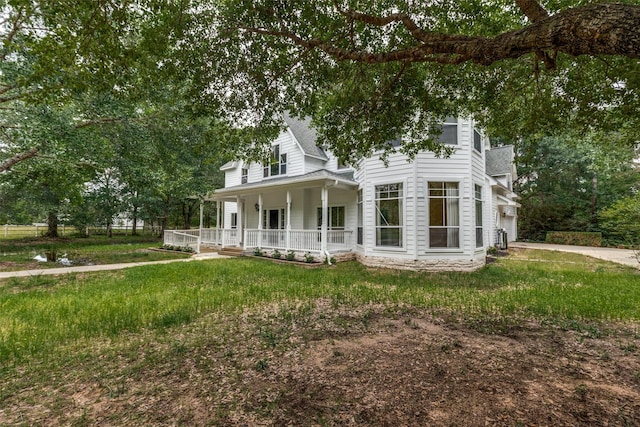 36111 Post Oak Cir, Magnolia, TX 77355 - view of front facade with covered porch, a garage, and driveway