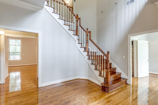 36111 Post Oak Cir, Magnolia, TX 77355 - stairway featuring wood finished floors and a high ceiling