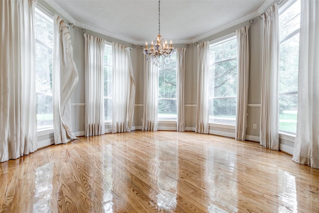 36111 Post Oak Cir, Magnolia, TX 77355 - unfurnished room featuring a chandelier, crown molding, and wood finished floors