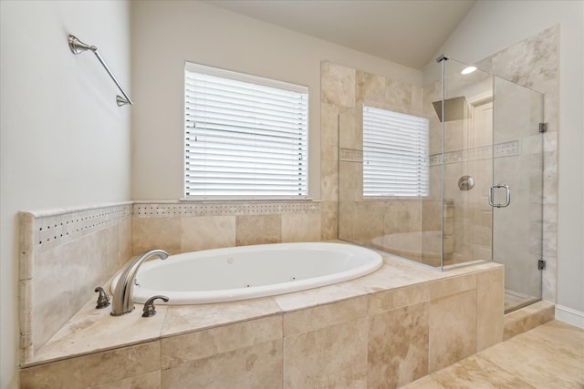 bathroom with shower with separate bathtub