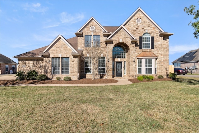 front facade with a front yard