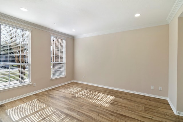 unfurnished room featuring hardwood / wood-style flooring and ornamental molding