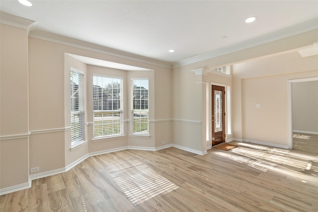 entrance foyer with crown molding and light wood-type flooring