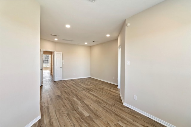 spare room featuring hardwood / wood-style flooring