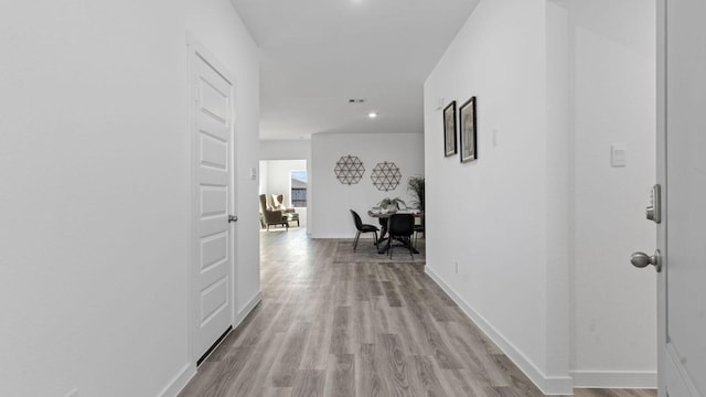 hall with light wood-type flooring