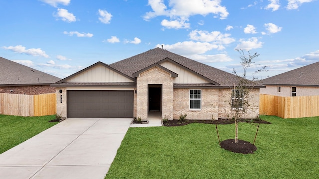 view of front of property with a garage and a front yard