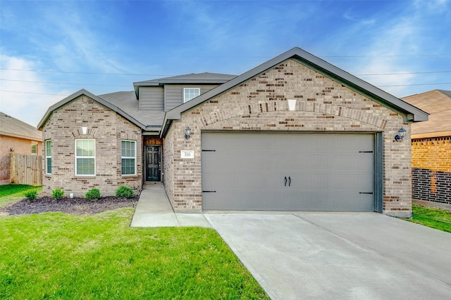 view of front facade featuring a garage and a front lawn