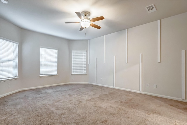 carpeted empty room with ceiling fan