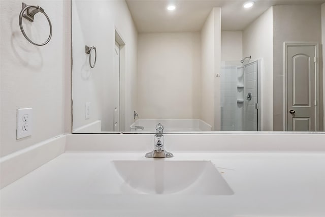 bathroom with vanity and a shower