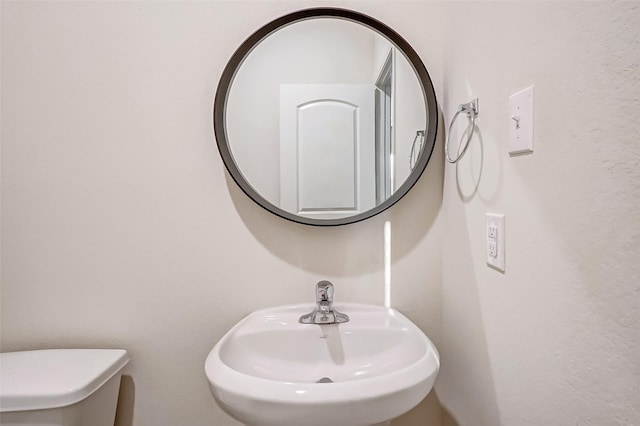 bathroom with sink and toilet