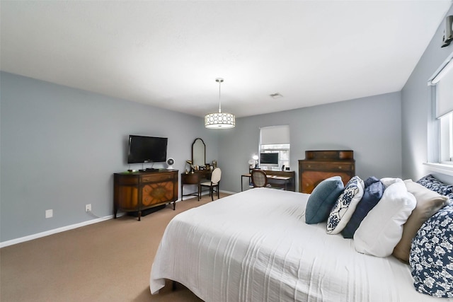 bedroom featuring carpet flooring and baseboards