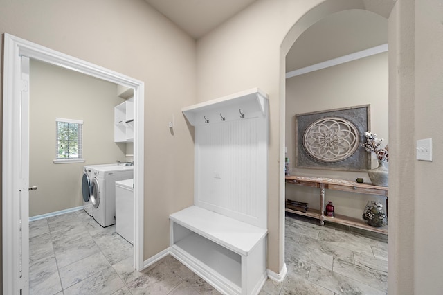 mudroom featuring washing machine and clothes dryer