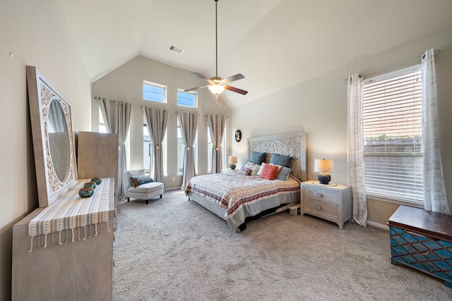 bedroom featuring multiple windows, ceiling fan, and carpet flooring