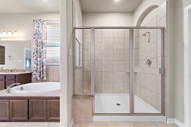 bathroom featuring vanity, separate shower and tub, and tile patterned flooring