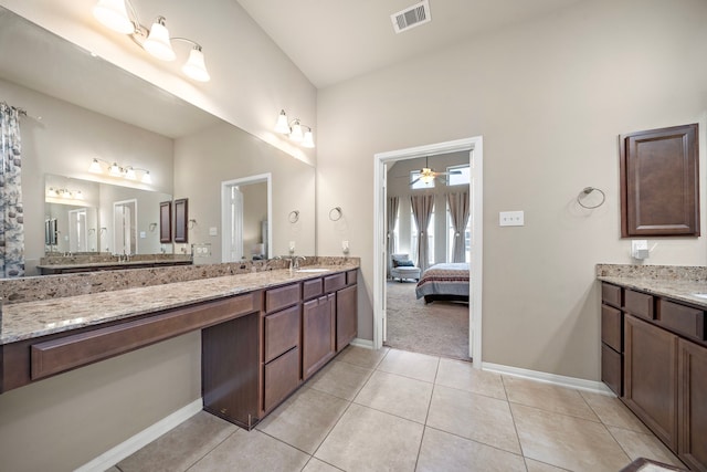 bathroom featuring vanity, tile patterned floors, and ceiling fan