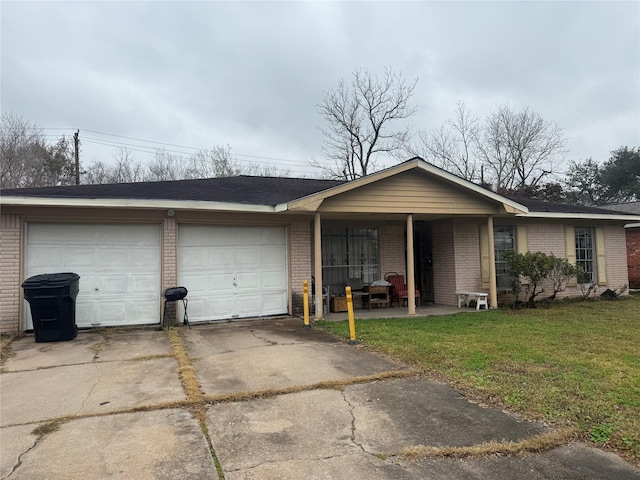 single story home with a garage and a front lawn