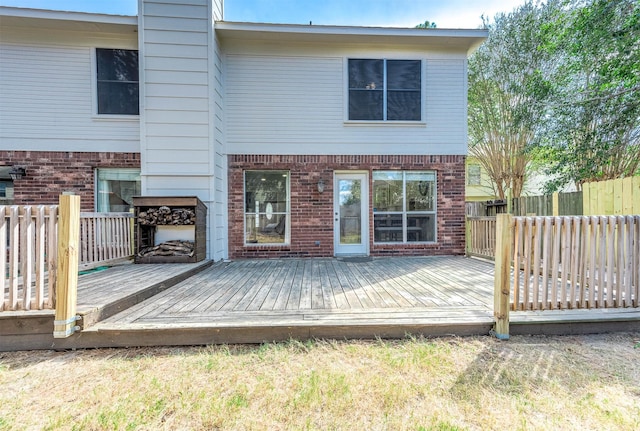 back of property featuring a deck