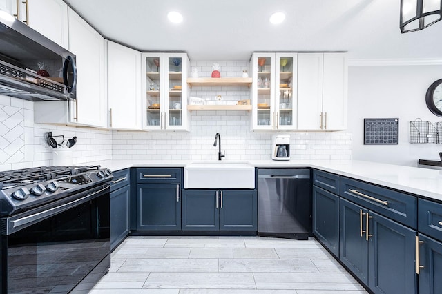 kitchen with sink, stainless steel appliances, white cabinets, and blue cabinetry