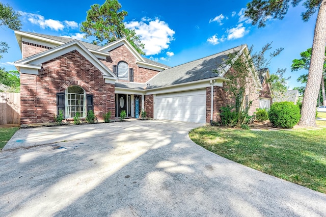 view of front property with a garage and a front lawn