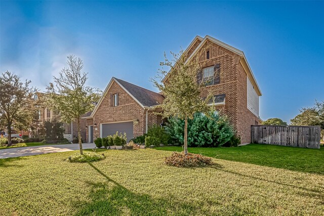 front of property featuring a garage and a front yard