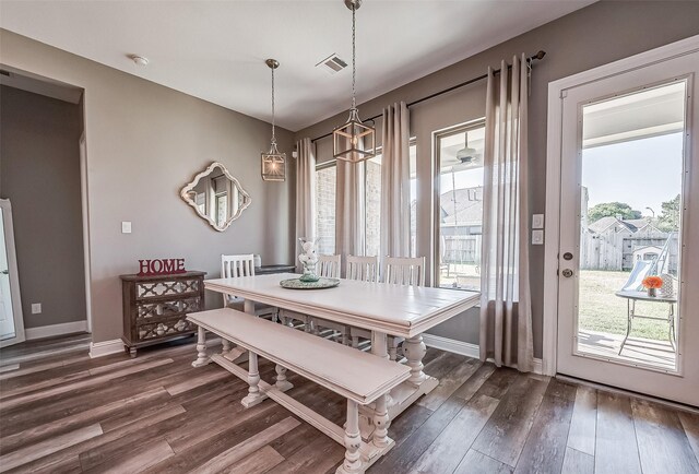 dining area featuring dark hardwood / wood-style floors